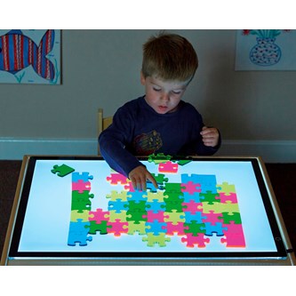 Puslespilsbrikker til lysbord